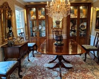 Beautifully appointed dining room, with Henkel-Harris banded mahogany table (includes 2 leaves, with original storage sleeves, pads and boxes, set/6 Hickory Chair Chippendale style hand carved mahogany side chairs, nicely framed "Three Pears" Encaustic, by Maggie Hasbrouck, 1994, hand woven Persian Kashan rug, 12' 2" x 8' 11", Chippendale style low boy chest, by Century Furn. Co., from their Henry Ford Museum Collection, pair of Century Furn. Co. lighted/beveled glass china cabinets, pair of gilt wood mirrors and gorgeous 13-light cut crystal Maria Theresa chandelier. 