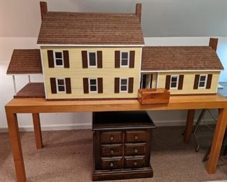 Huge hand made dollhouse on table - this thing took the owner five yers to make and he's very proud of his handwork!