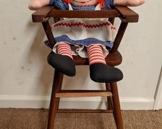 Ain't she cute? Vintage Raggedy Ann doll in child's high chair.