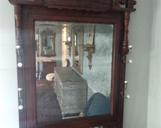 Antique Eastlake wall mirror, with coat/hat rack.