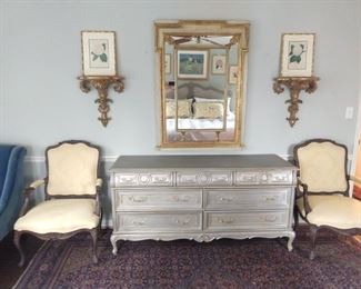 Beautiful, 7-drawer, silver-leafed  dresser, pair of gilt wood wall sconces, pair of framed, antique antique botanical prints and vintage Italian wall mirror. 