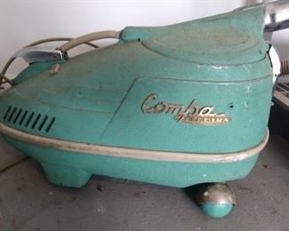 Vintage turquoise vacuum cleaner - very Jetsons!