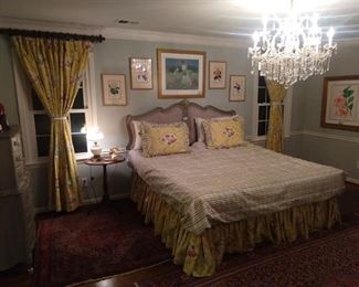 Night time view of the bedroom, with the soft glow of a 13-light, cut crystal chandelier to work it's romantic magic.