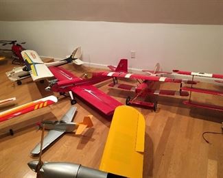 Remote control airplanes, helicopters & trucks assembled. New in box large airplanes also available. Parts, R/C controllers, field boxes, stands & accessories available too.  Wing span and names are available upon request if interested. Additional pictures are within this listing.