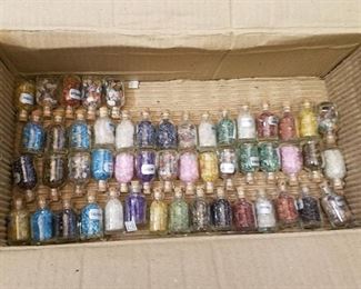 approximately 50 small bottles of assorted gems
