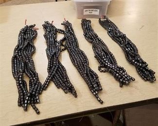 approximately 50 strands of 9 by 9 m m drum beads