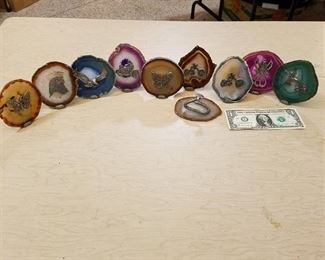 approximately 40 polish geodes with figurines affixed to them