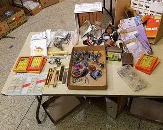 large lot of assorted miscellaneous items - watch bands, keychain lasers, eyeglass repair kits, clear plate stands, Etc