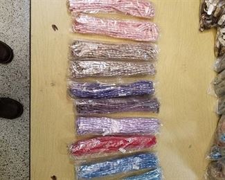 10 bags of assorted beaded strands - approximately 10 strands per bag