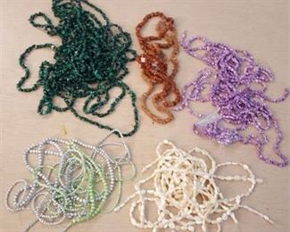 approximately 50 strands of beads - assorted colors