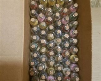 approximately 60 assorted small gem bottles