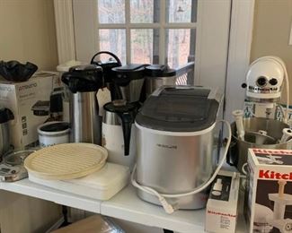 KitchenAid mixer, KitchenAid pasta attachment, KitchenAid grinder attachment.  Ninja brewing system, Frigidaire portable ice maker. 