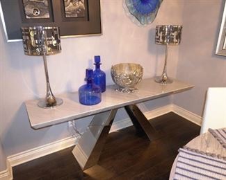 Chrome and marble dining table with white leather chairs with matching console table