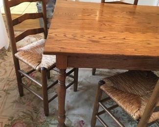 Antique dining room table. Also set of 8 ladderback chairs with cane seats
