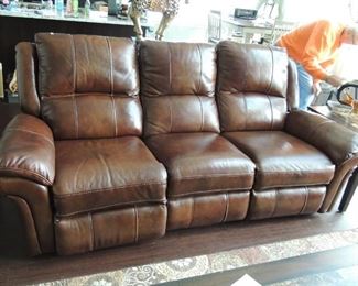 Leather sofa with recliners on each end.