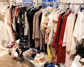 Dozens of modern name brand (many new with tags) and vintage garments. 