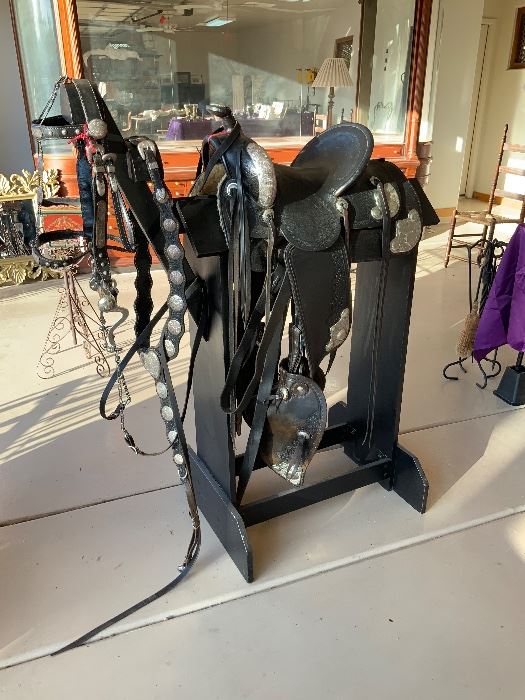 Gorgeous Parade Saddle 14" it has been used as a beautiful display. All Sterling Silver, Bridle, Chest plate, Stirrups, and Stand. $5500