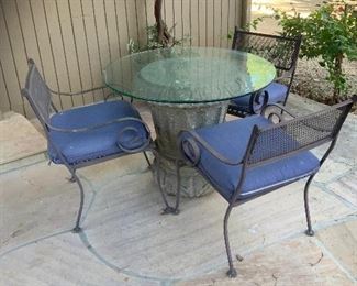 Cement patio table base, glass top and 3 wrought iron chairs $250