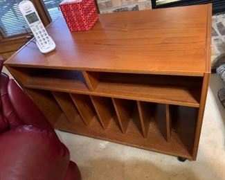 #40  hand made tv cabinet w record holder and 2 shelves 32x17x21 on wheels   $ 45.00