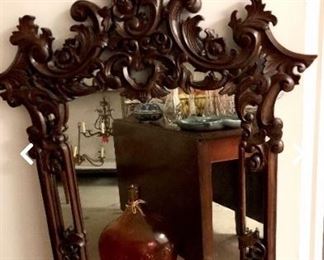 Stunning vintage, carved, large mahogany mirror in pristine condition.