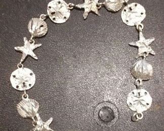 https://www.ebay.com/itm/124156078617 RX4152003 STERLING SILVER 925 7 INCH SEA SHELL, SAND DOLLAR, STAR FISH BRACELET RX BOX 1 RX415203 $19