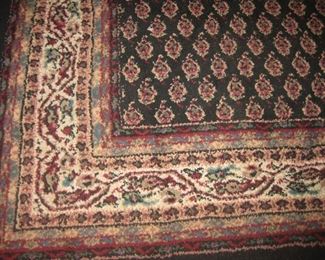Large formal rug approx. 7-1/2'  x  11'  black background with tones of red in design