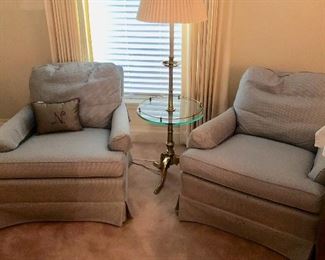 two occasional chairs, light blue, could be used in bedroom space