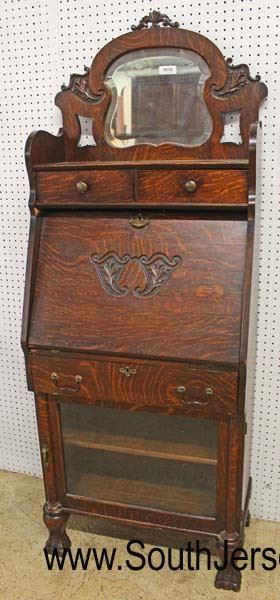  ANTIQUE Oak all Original Fancy Carved Slant Front Desk with Bookcase Bottom and Fancy Mirror Top

Auction Estimate $300-$600 – Located Inside 
