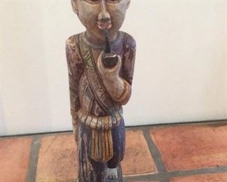 Smoking Asian man wood statue 