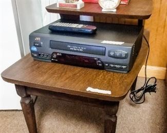 Side table, VCR, vintage alarm clock