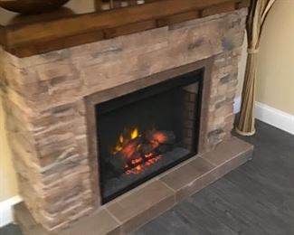 Slate and stone electric fireplace - very heavy! Measures:  43” height x 56” width x 16” depth