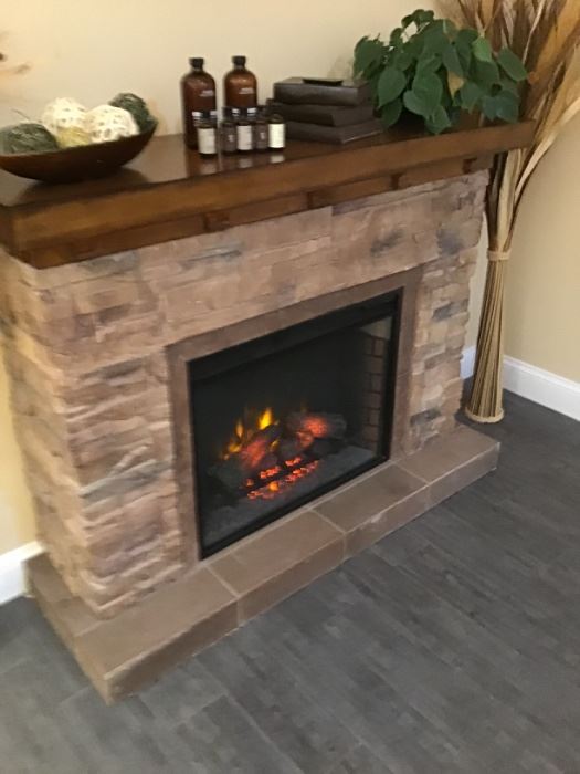 Slate and stone electric fireplace - very heavy! Measures:  43” height x 56” width x 16” depth