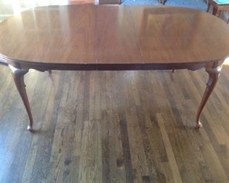 Pioneer Furniture Queen Anne genuine mahogany table with two 12" leafs and table pads included.