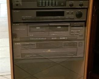 Sony stereo tower cabinet with CD, cassette tape,  radio and synthesizer
