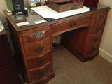 Antique Desk--Look at the beautiful carved drawer fronts....Unusual piece and with glass top to protect surface.