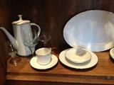 Complete Noritake China Set
Blue-tinted crystal stemware to match the pale blue in the subtle Noritake pattern