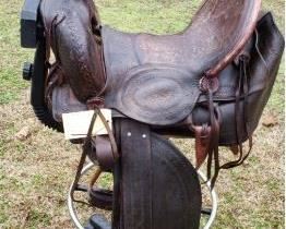 Western Highback Saddle. 17 inch high back full skirt western saddle. Carved leather with lacing and leather conchos. https://ctbids.com/#!/description/share/314535