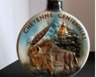 Cheyenne Centennial Jim Beam decanter from 1967 and Wyoming pin. https://ctbids.com/#!/description/share/314528