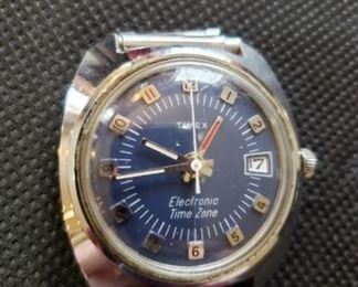Vintage Timex Watch with blue face, Electronic Time Zone, back plate is open. https://ctbids.com/#!/description/share/314512