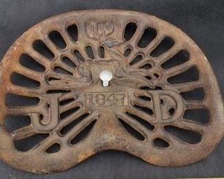 Cast iron John Deere tractor seat.  https://ctbids.com/?site=1#!/description/share/314372