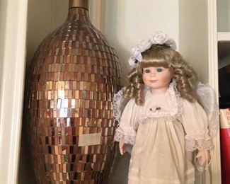 Doll and colorful vase