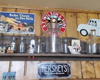 Old milk bottles and advertising signs. 