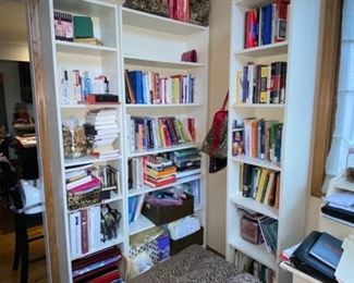 White book cabinet and books