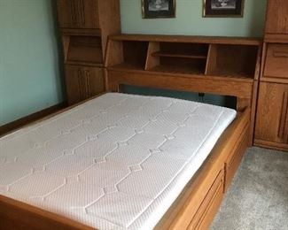 Queen size platform bed with storage drawers, bookcase headboard and matching storage side units