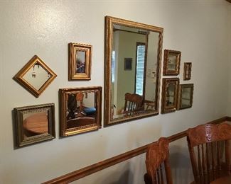 many mirrors and wall decorations