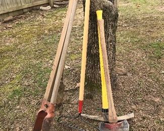 post hole diggers, post driver, pick ax, rakes, 