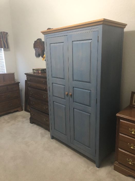 wood armoire /cabinet  lots of storage here 