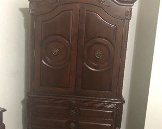 armoire or ent center- has bar for hanging clothes 