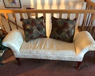 Small winged couch with beautiful pillows