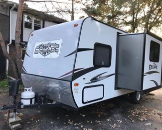 Off Site:  2016 Spree Escape Travel Trailer includes power lift, power slide-out, power awning, bike rack, etc. excellent condition.